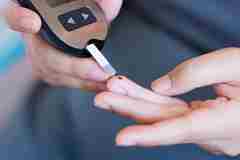A person checking their blood sugar levels. 